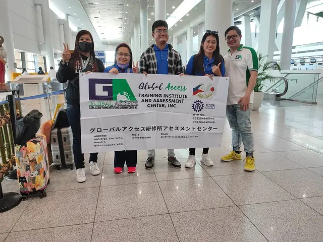 Five people holding the GLOBAL ACCESS banner in the airport terminal