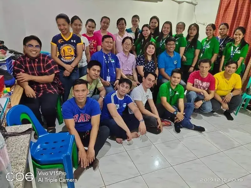A full training class seated together in a classroom