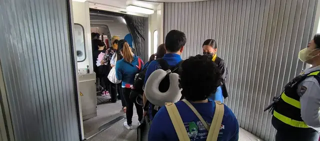 Participants boarding through the jet bridge
