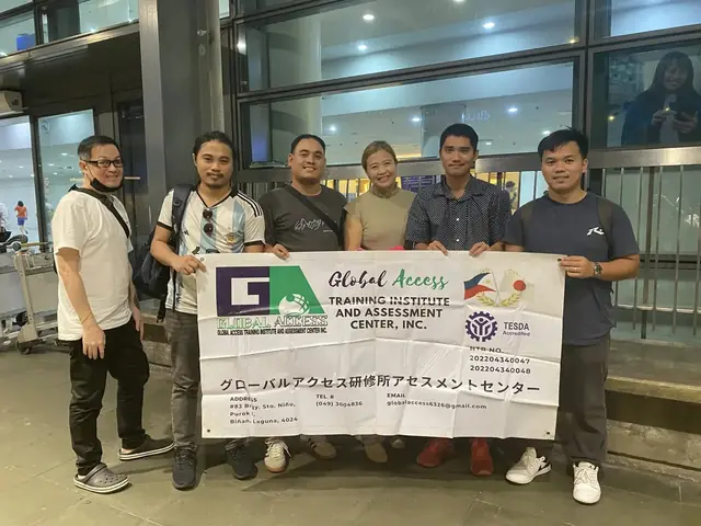 Six people standing behind the GLOBAL ACCESS banner at the airport